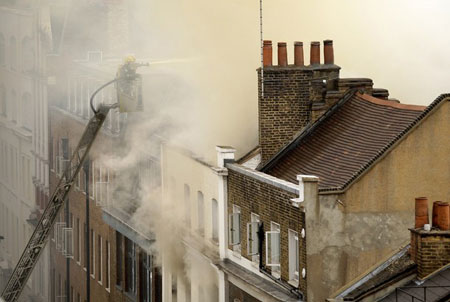 Fire crews tackle a blaze in Dean Street in central London, on July 10, 2009. Sixty firefighters from twelve fire engines have been sent to the scene. The cause of the fire has not yet been established